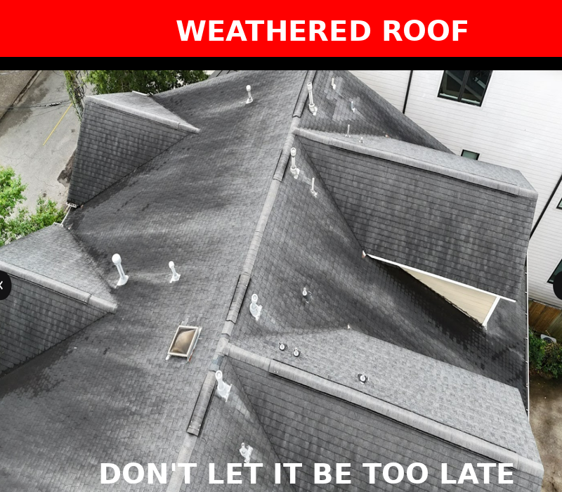 Aerial view of a large roof with visible signs of weathering, including lifted shingles and discoloration, indicating aging roof materials.

