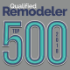 An award badge featuring the words "Qualified Remodeler" in dark blue at the top. Below, the text "TOP 500 2018" is prominently displayed, with "TOP" vertically aligned next to "500," and "2018" vertically aligned on the right. The background is gray.