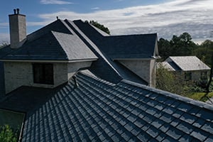 side view of home with composite roof and blue sky in background