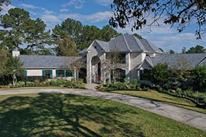 a large home with gray composite slate roof