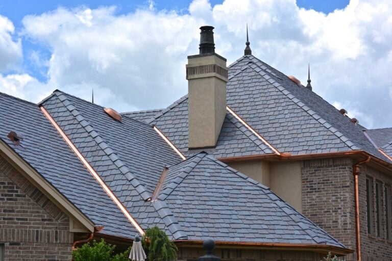 large slate roof with copper accents