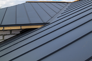 upclose view of standing seam black metal roof