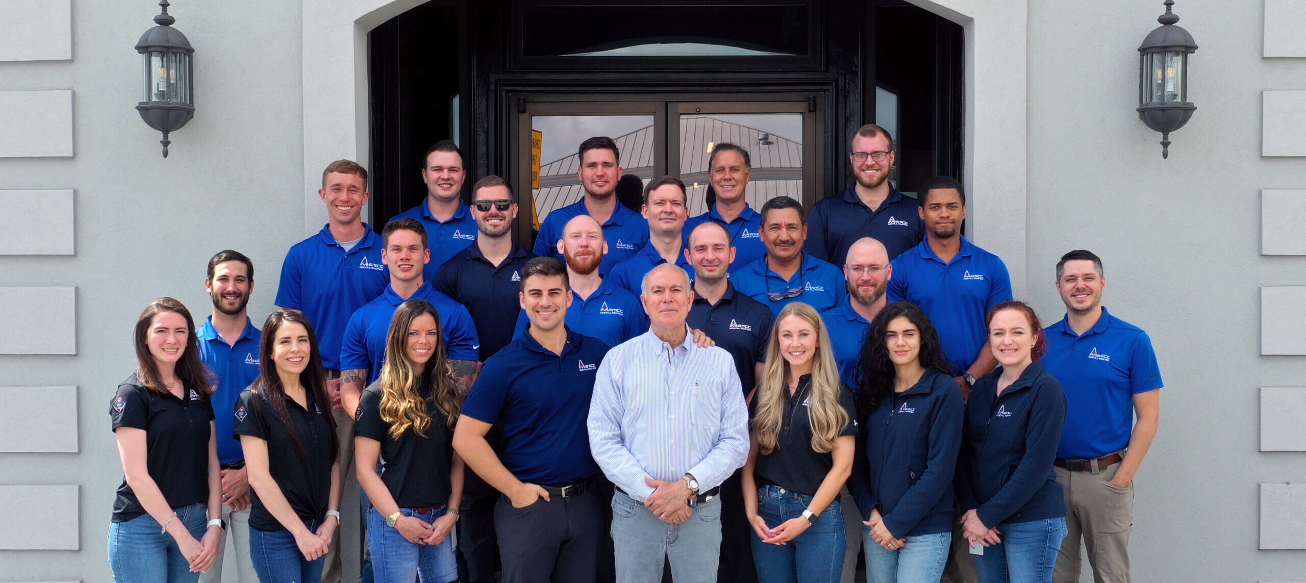 amstill roofing company in houston, team photo in front of Amstill's office