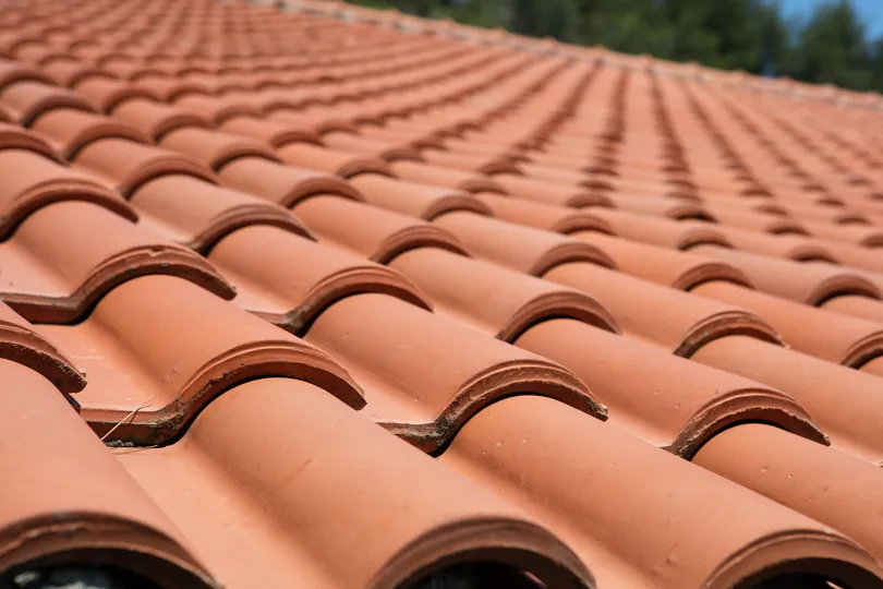 red clay tile roof close-up photo on texas home