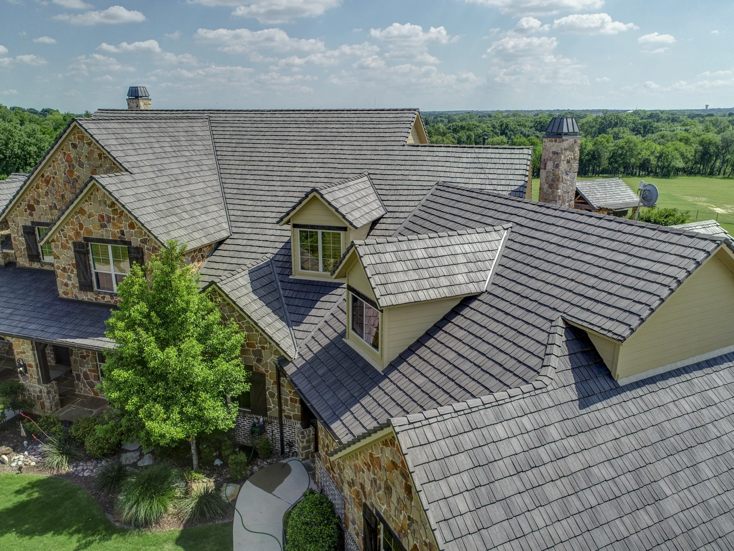 large home in country with beautiful davinci shake roof
