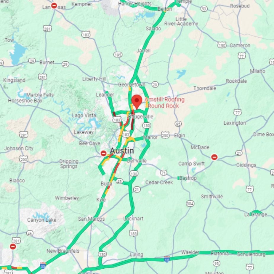A map showing traffic conditions around Austin, Texas. Green lines indicate smooth traffic flow, yellow lines show moderate traffic, and red lines represent heavy congestion. Key locations such as Austin, Round Rock, and San Marcos are marked on the map.
