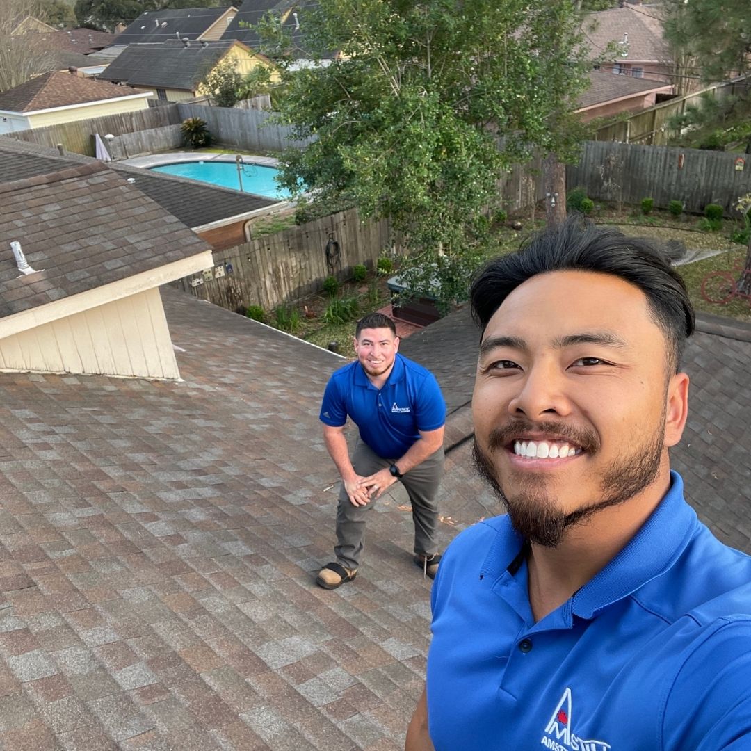 Two of our roof consultants conducting a free Houston roof inspection, ensuring homeowners receive expert advice and quality service.